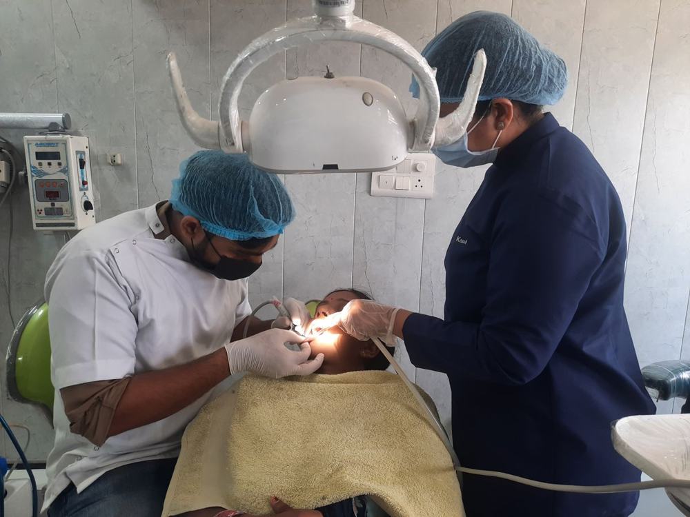 Dr Bisherwal and his assistant at work
