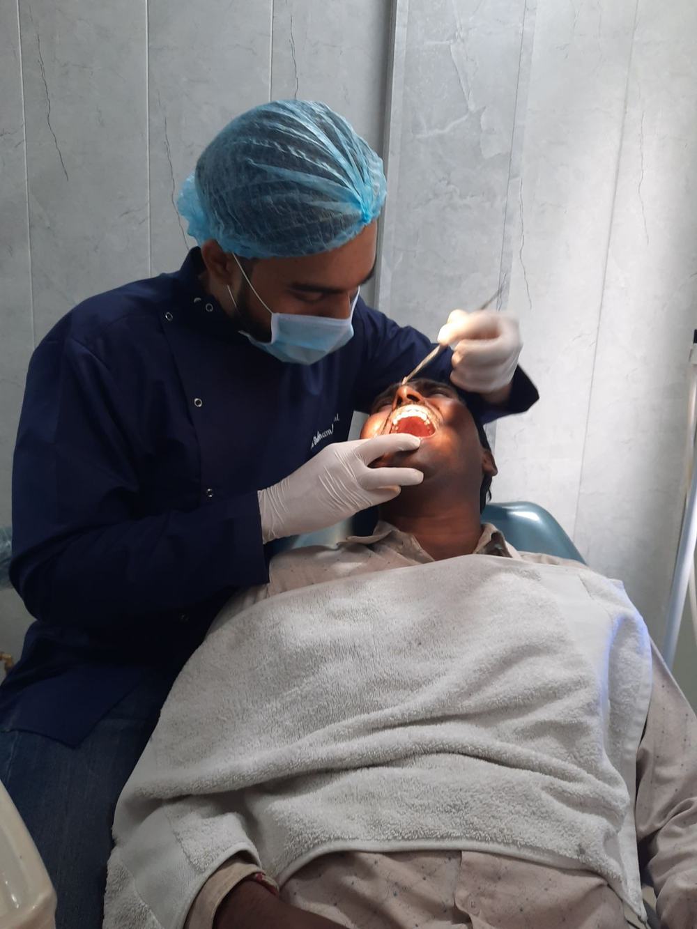 Dr Shubham Bisherwal treating a patient