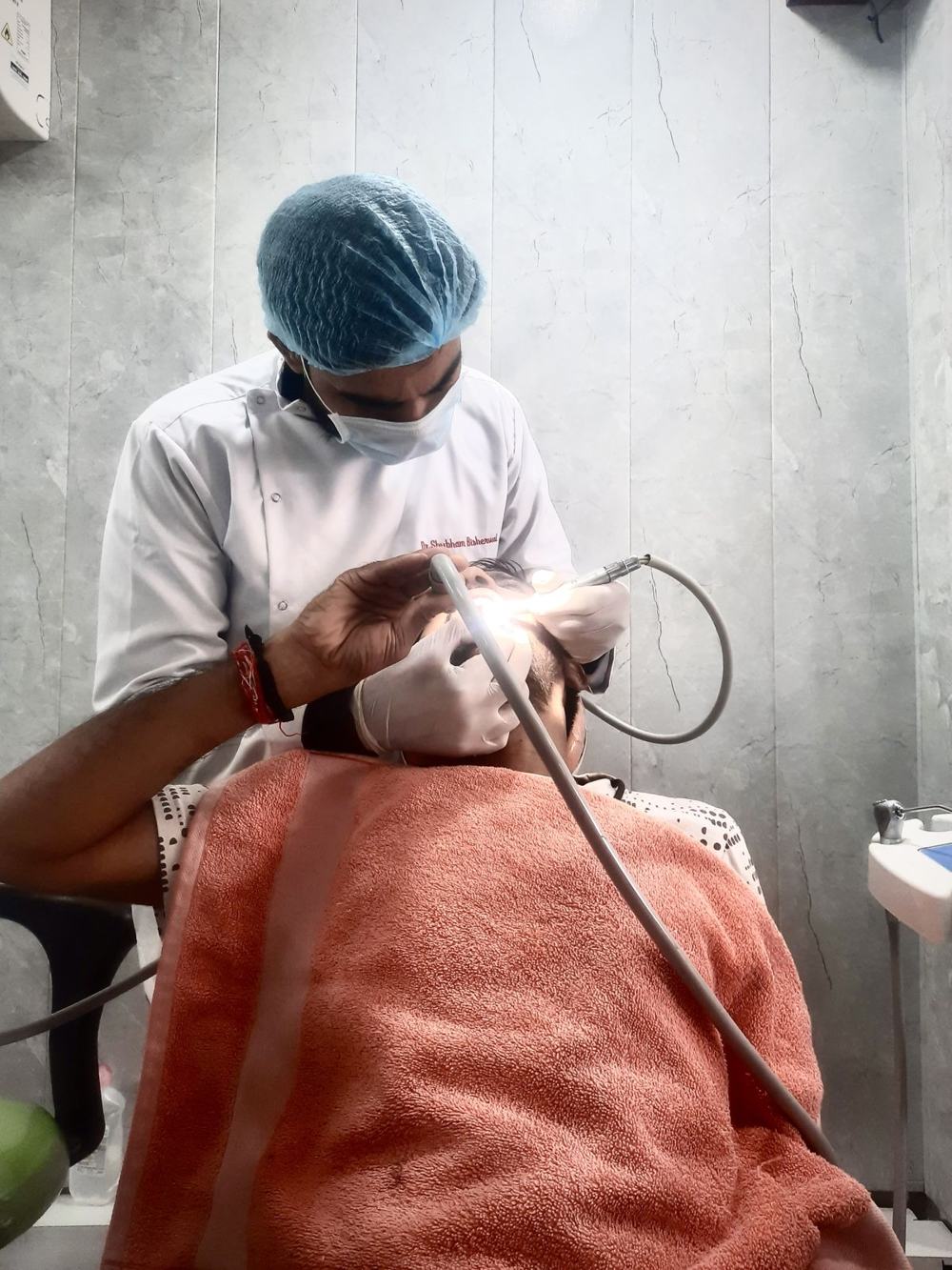 Dr Bisherwal treating a patient